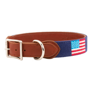 American Flag Needlepoint Dog Collar with navy blue background showing a  repeating pattern of evenly spaced American flags. The dog collar has durable stainless steel and full grain leather backing and strap.