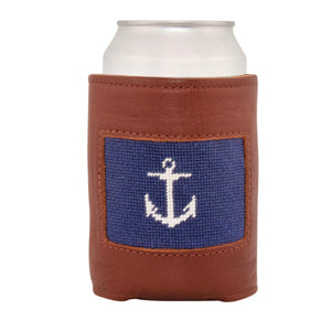 Front face of anchor needlepoint can cooler showing hand-stitched needlepoint white anchor against a dark navy blue background. Soft leather body with interior neoprene lining. Great fit for a standard 12 ounce can.