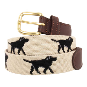 Black Lab Needlepoint Belt with khaki background showing a repeating pattern of evenly spaced black labradors. Belt has a brass buckle and full grain leather backing and strap.