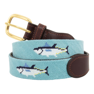 Bluefin Tuna Needlepoint Belt with light blue background showing a repeating pattern of evenly spaced blue fin tuna fish around the belt. Belt has a brass buckle and full grain leather backing and strap.