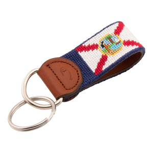 Hand-stitched Florida Flag needlepoint keychain showing the Florida Flag on both sides against a navy blue background and leather backing.  Stainless steel D-ring and keyring.
