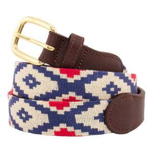 Gaucho Needlepoint Belt showing a gaucho pattern in red white and blue. Belt has a brass buckle and full grain leather backing and strap.