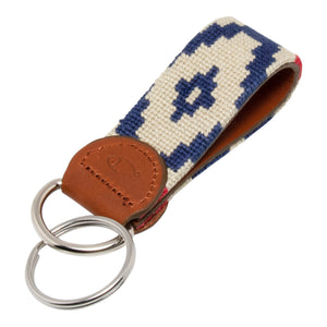Hand-stitched Gaucho needlepoint keychain showing a red white and blue gaucho pattern on both sides with leather backing.  Stainless steel D-ring and keyring.