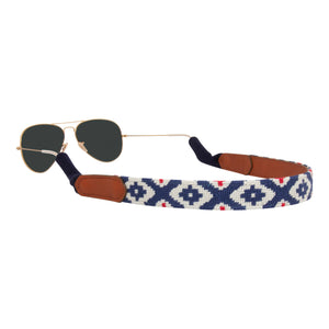 Gaucho needlepoint sunglass strap showing a red white and blue classic gaucho pattern with sturdy cotton covered silicone ear connectors and a soft leather backing