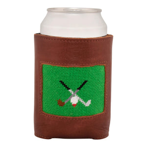 Front face of Golfing Needlepoint Can Cooler showing hand-stitched needlepoint crossed golf clubs with green background. Soft leather body with interior neoprene lining. Great fit for a standard 12 ounce can.