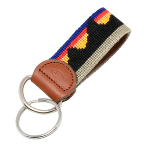 Hand-stitched Mountain Range needlepoint keychain showing a western mountain range pattern on both sides with leather backing.  Stainless steel D-ring and keyring.