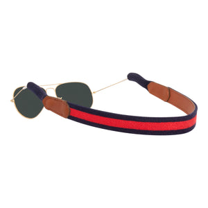 Red stripe with navy blue background needlepoint sunglass strap hand-stitched with sturdy cotton covered silicone ear connectors and a soft leather backing