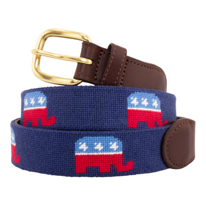 Republican needlepoint belt with a navy blue background showing a repeating pattern of evenly spaced republican elephant logos.  Belt has a brass buckle and full grain leather backing and strap.