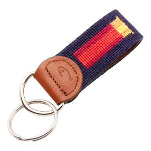 Hand-stitched shotgun shell needlepoint keychain showing a classic red shotgun shell on both sides against a navy blue background and leather backing.  Stainless steel D-ring and keyring.