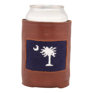 Front face of south carolina needlepoint can cooler showing hand-stitched needlepoint palmetto and crescent in white against a dark navy blue background. Soft leather body with interior neoprene lining. Great fit for a standard 12 ounce can.