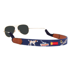 Handstitched southern sportsman themed needlepoint sunglass strap showing shotgun dove pointer dog fish patterns against a navy blue background with sturdy cotton covered silicone ear connectors and a soft leather backing
