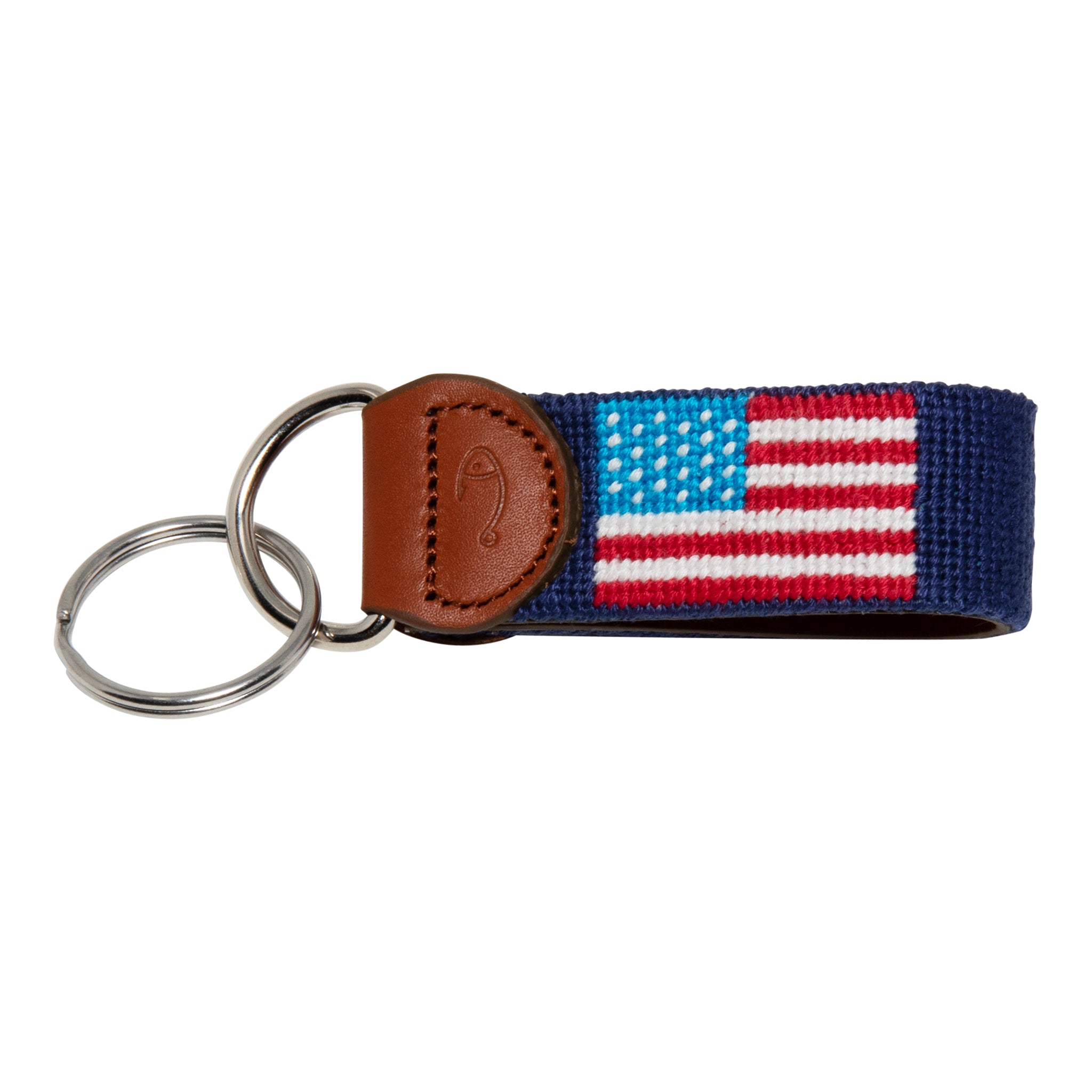 Hand-stitched American Flag needlepoint keychain showing American Flag on both sides against a navy blue background and leather backing.  Stainless steel D-ring and keyring.