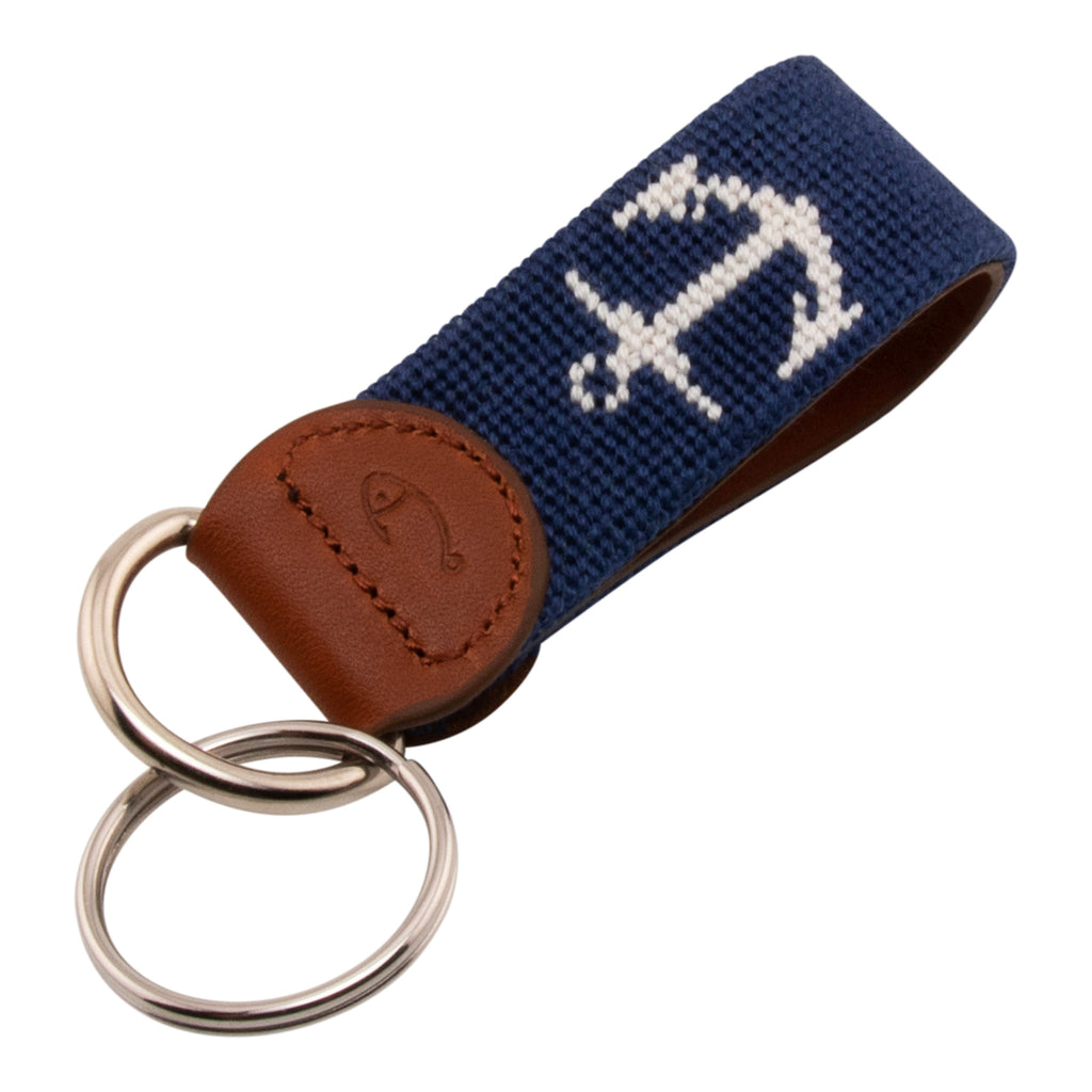 Hand-stitched needlepoint keychain, ship's anchor design in white on both sides with navy blue background high-quality leather and cotton thread, stainless steel D-ring and keyring.