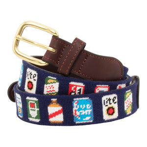 Beer Can Needlepoint Belt with navy blue background showing a repeating pattern of popular beer cans around the belt. Belt has a brass buckle and full grain leather backing and strap.