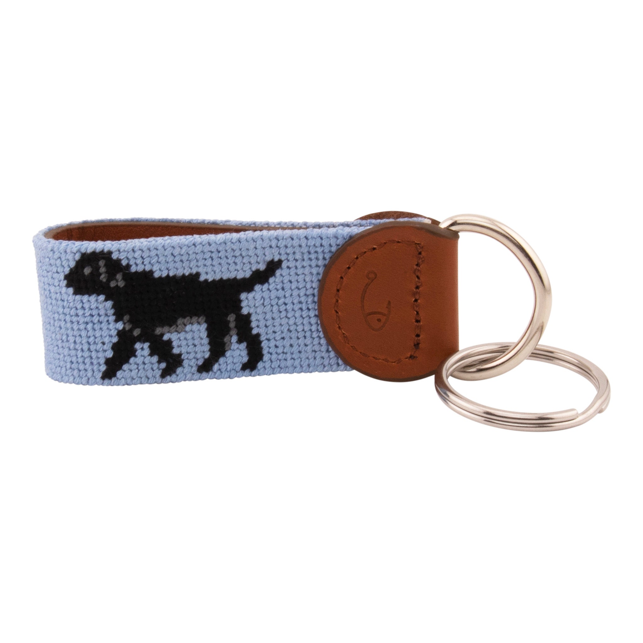 Hand-stitched black Labrador needlepoint keychain showing a black lab on both sides against a light blue background and leather backing.  Stainless steel D-ring and keyring.