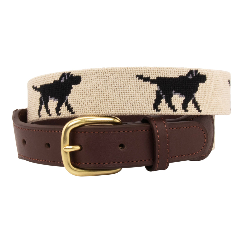 Black Lab Needlepoint Belt with khaki background showing a repeating pattern of evenly spaced black labradors. Belt has a brass buckle and full grain leather backing and strap.
