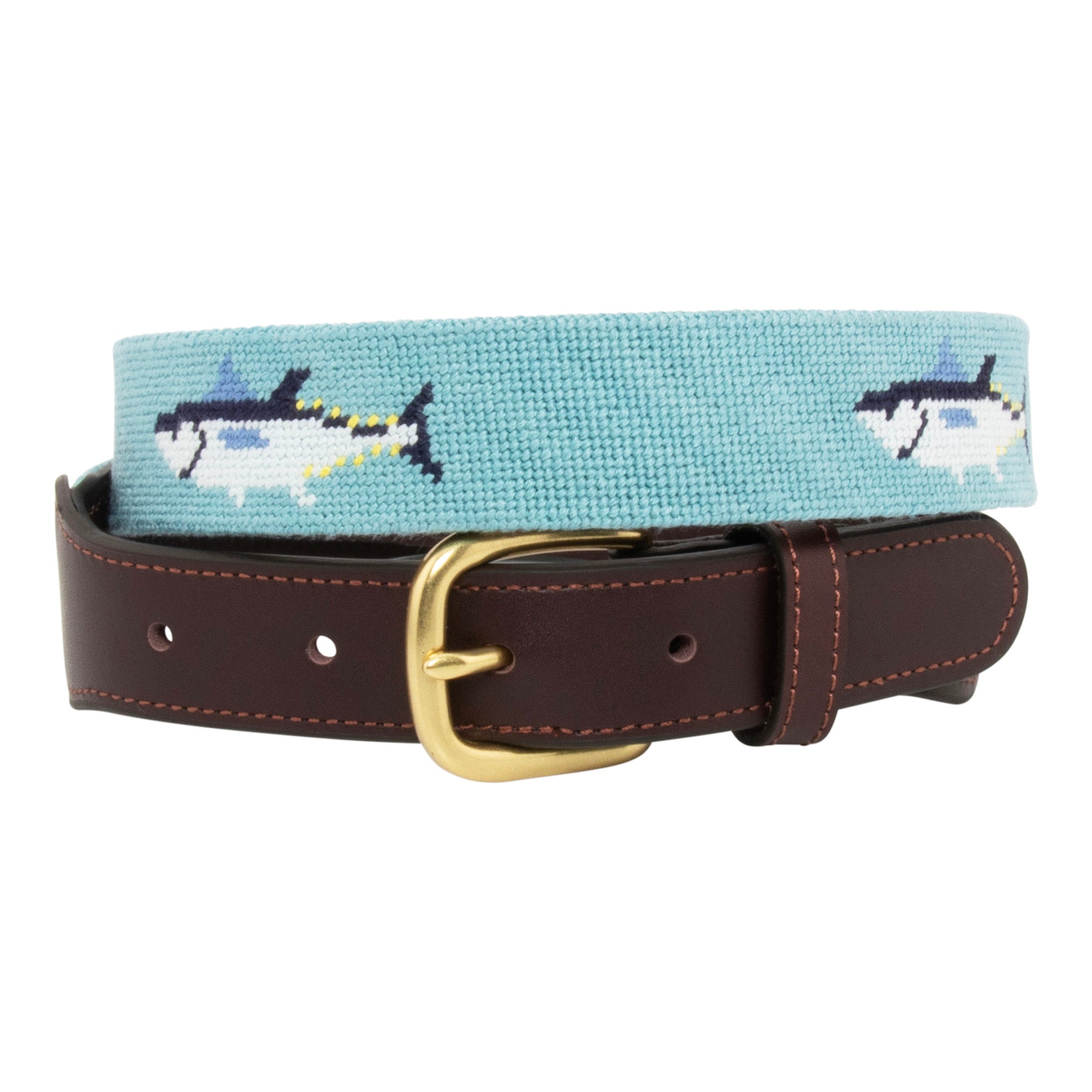 Bluefin Tuna Needlepoint Belt with light blue background showing a repeating pattern of evenly spaced blue fin tuna fish around the belt. Belt has a brass buckle and full grain leather backing and strap.