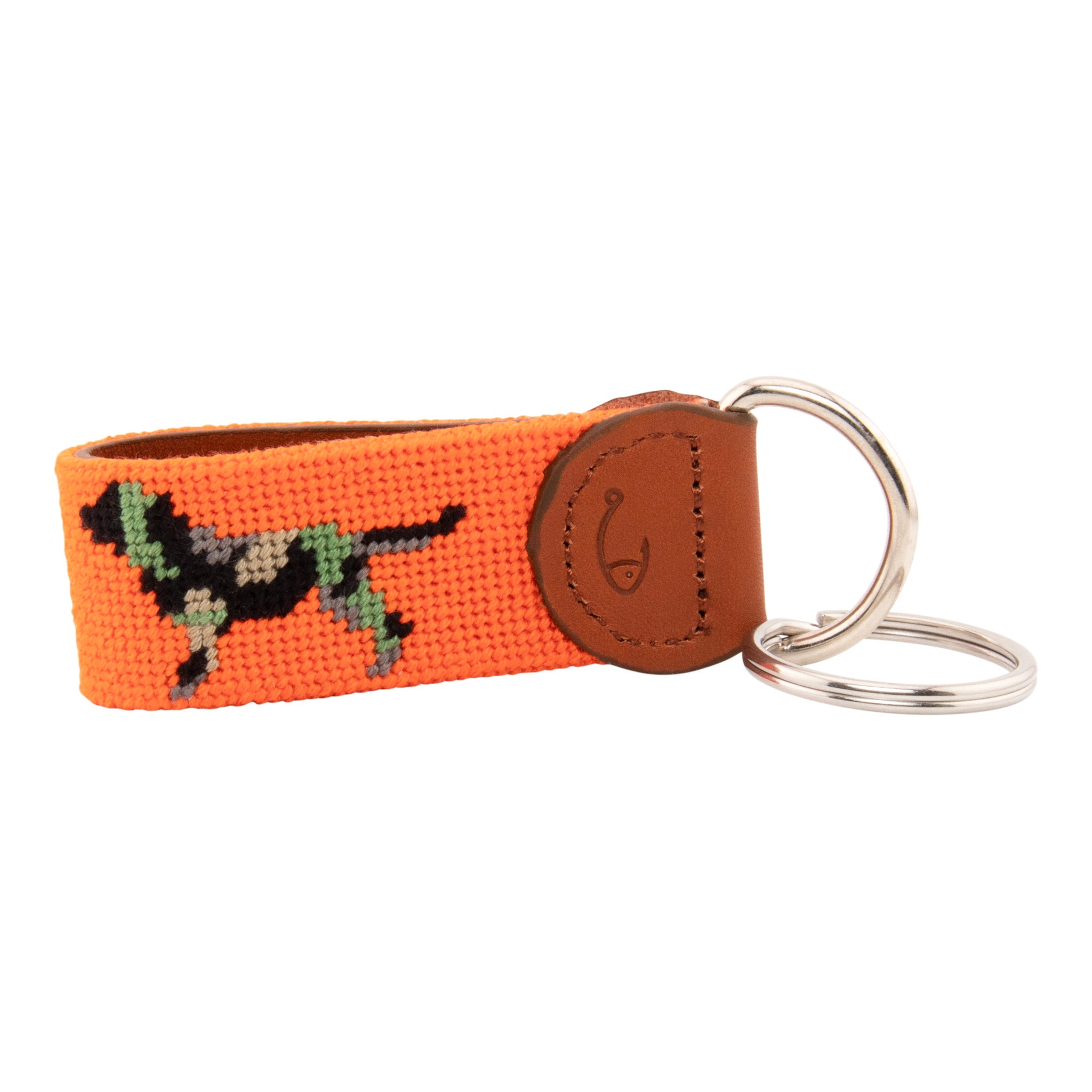 Needlepoint keychain with jungle camouflaged dog against blaze orange background, leather backing, stainless steel key ring, same pattern on both sides