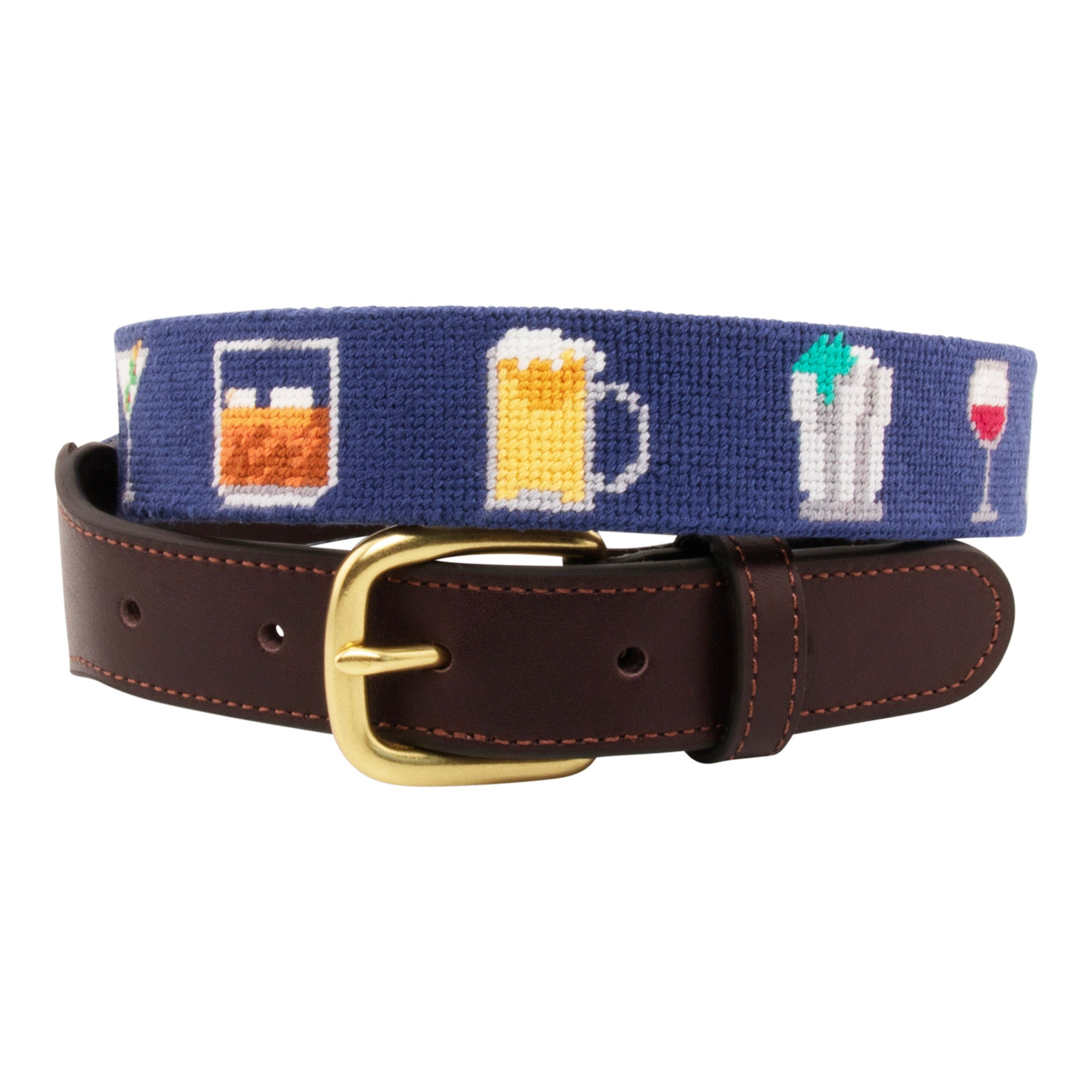 Cocktail Needlepoint Belt with navy blue background showing a repeating pattern of popular cocktails such as a martini, bourbon on the rocks, glass of wine, beer, mint julep around the belt. Belt has a brass buckle and full grain leather backing and strap.
