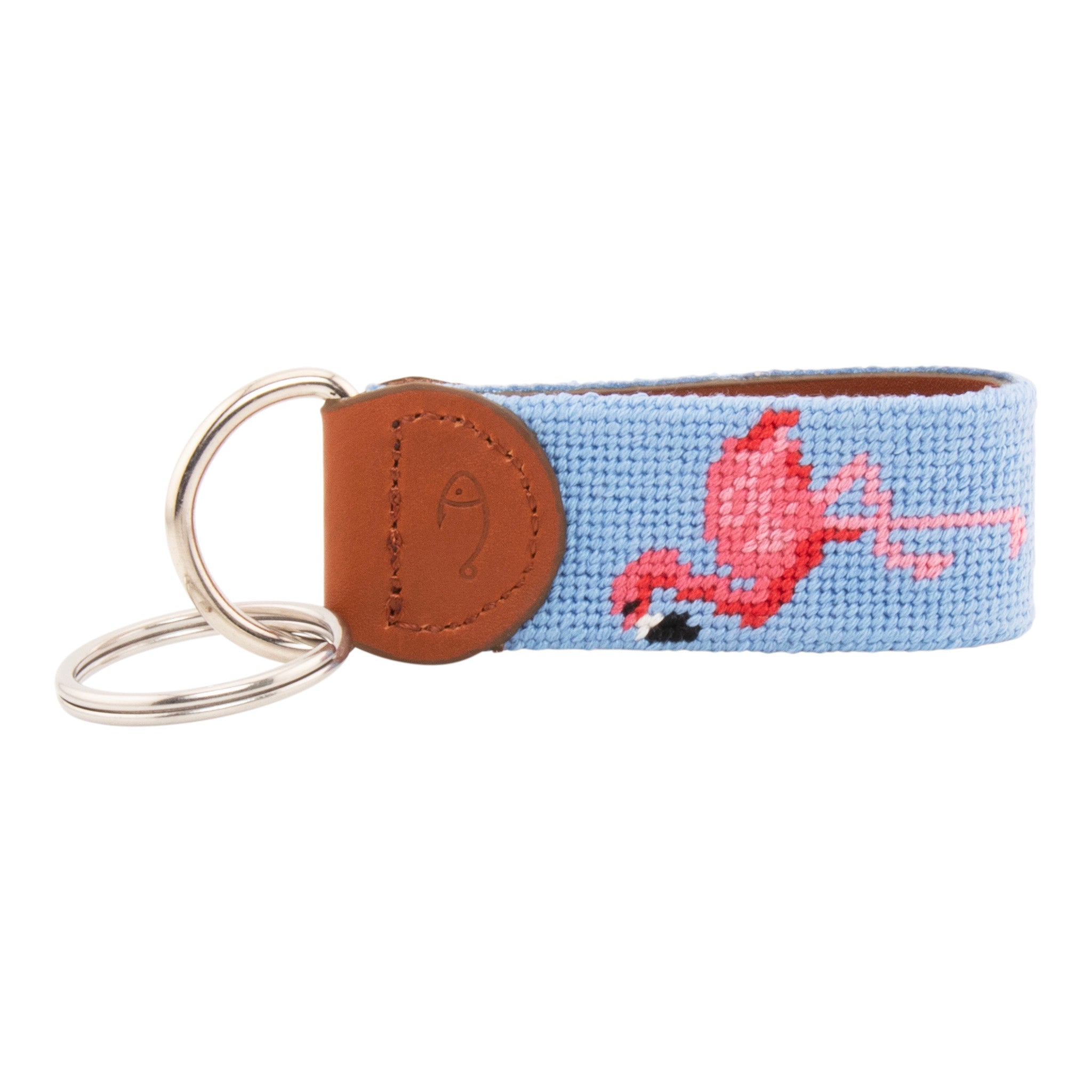 needlepoint keychain showing a pink flamingo on both sides against a light blue background, hand-stitched, leather backing, and stainless steel hardware