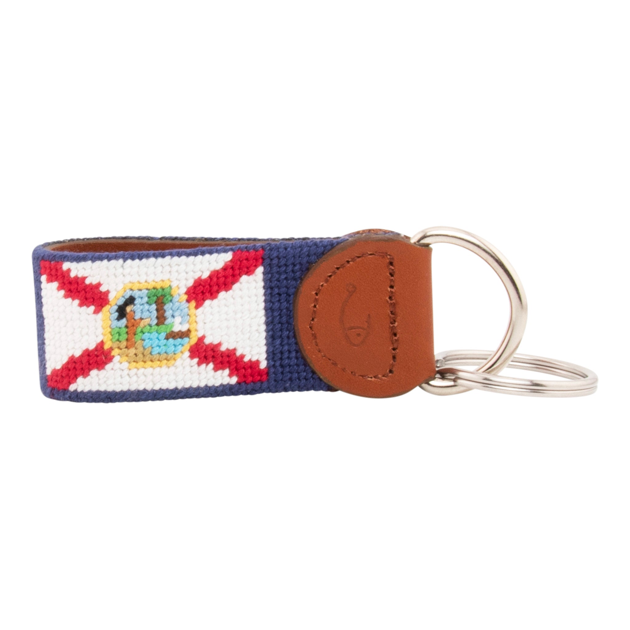 Hand-stitched Florida Flag needlepoint keychain showing the Florida Flag on both sides against a navy blue background and leather backing.  Stainless steel D-ring and keyring.