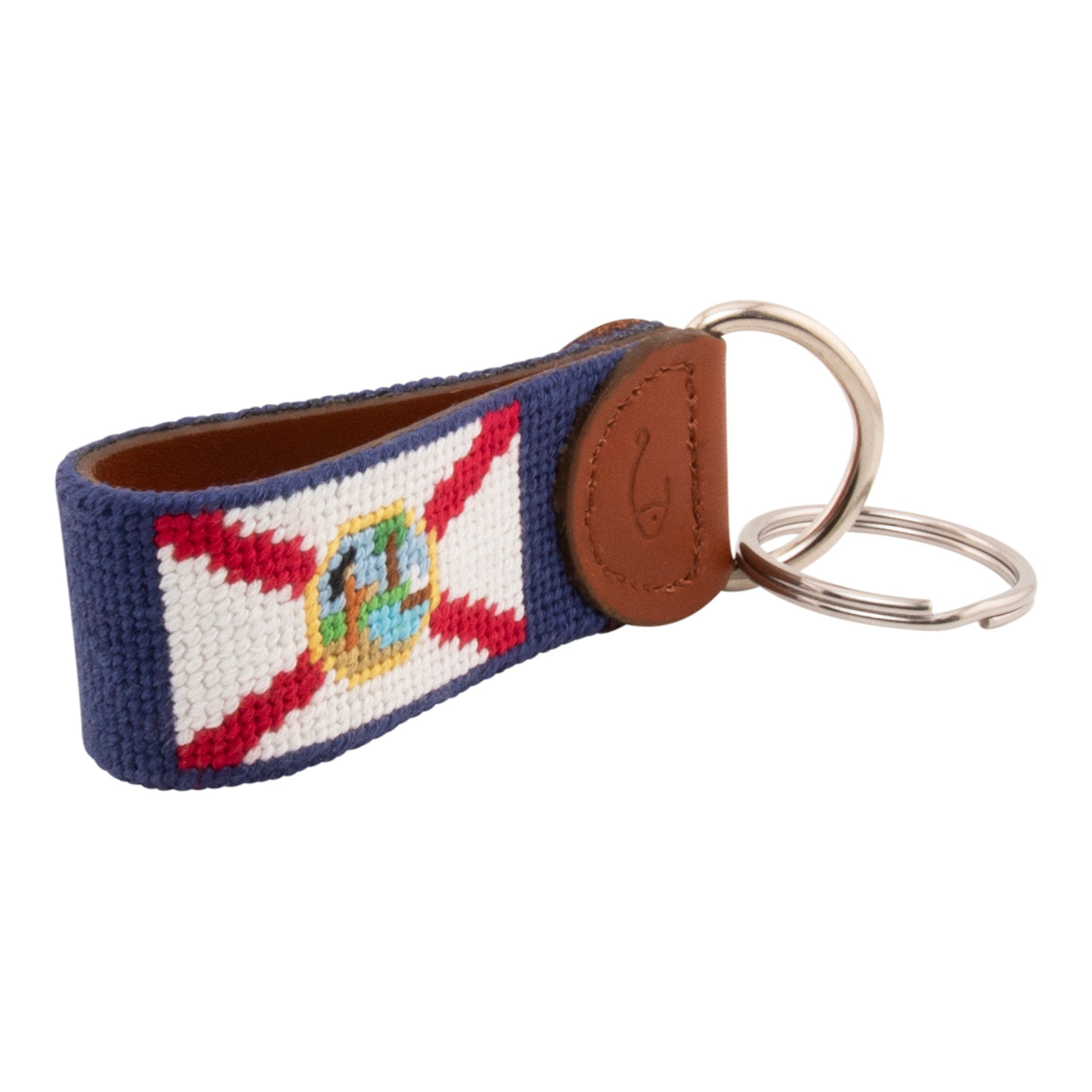 Hand-stitched Florida Flag needlepoint keychain showing the Florida Flag on both sides against a navy blue background and leather backing.  Stainless steel D-ring and keyring.