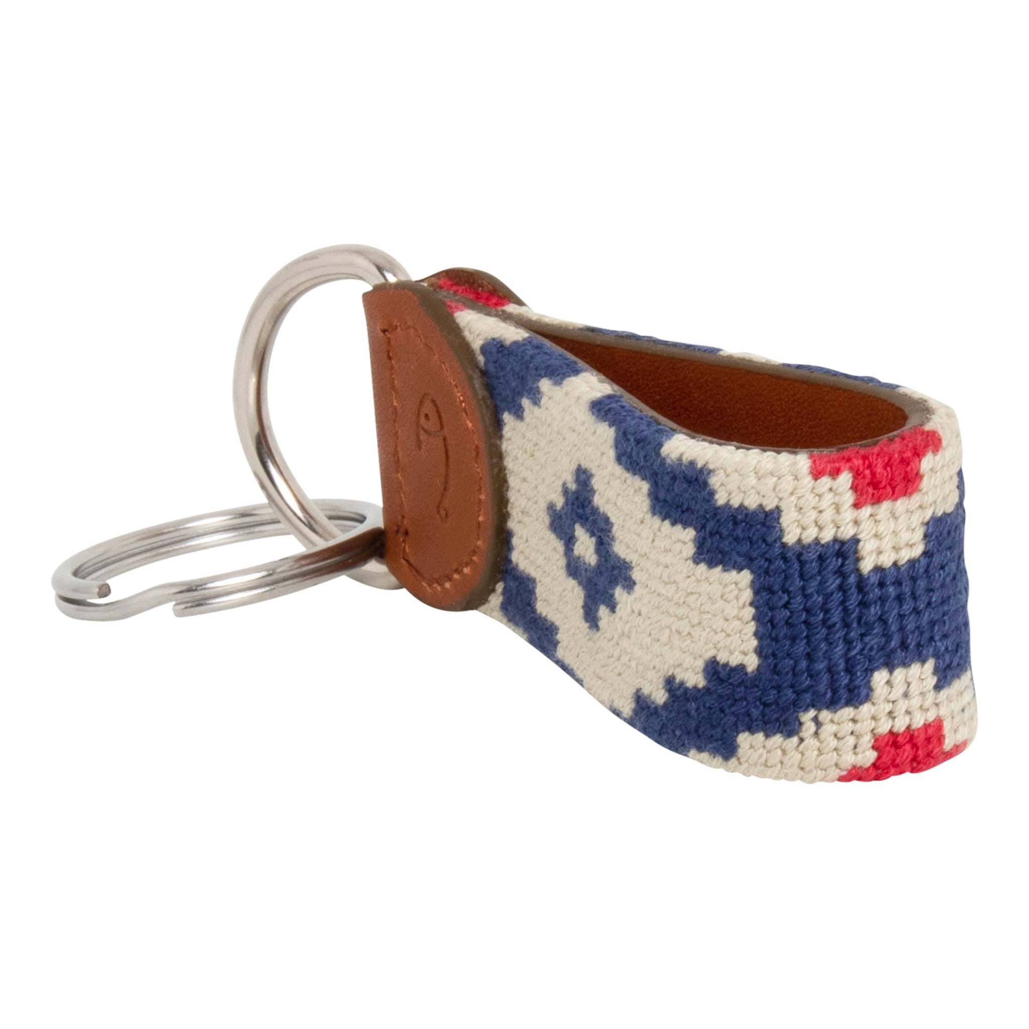 Hand-stitched Gaucho needlepoint keychain showing a red white and blue gaucho pattern on both sides with leather backing.  Stainless steel D-ring and keyring.