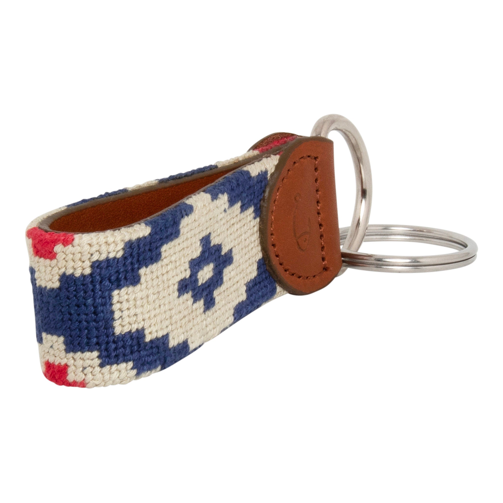 Hand-stitched Gaucho needlepoint keychain showing a red white and blue gaucho pattern on both sides with leather backing.  Stainless steel D-ring and keyring.