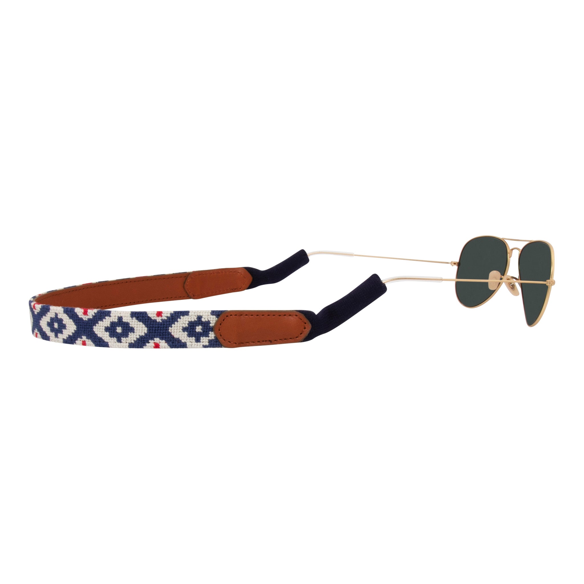 Back view gaucho needlepoint sunglass strap showing a red white and blue classic gaucho pattern with sturdy cotton covered silicone ear connectors and a soft leather backing