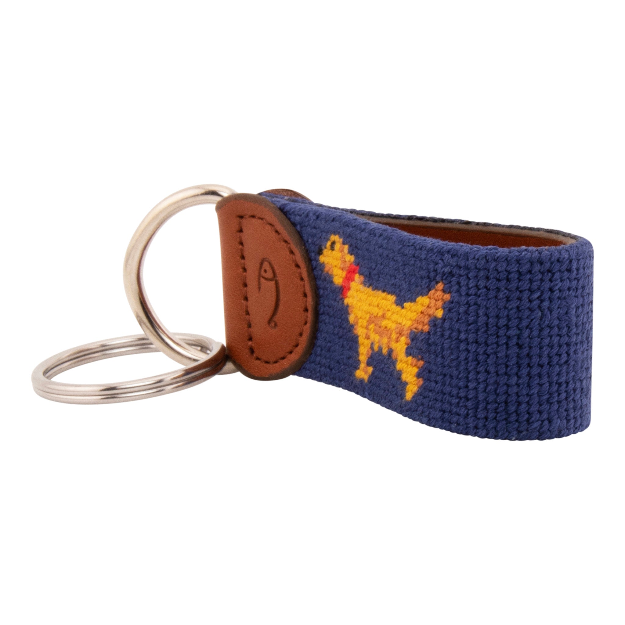 Hand-stitched Golden Retriever needlepoint keychain showing a golden retriever on both sides against a navy blue background and leather backing.  Stainless steel D-ring and keyring.