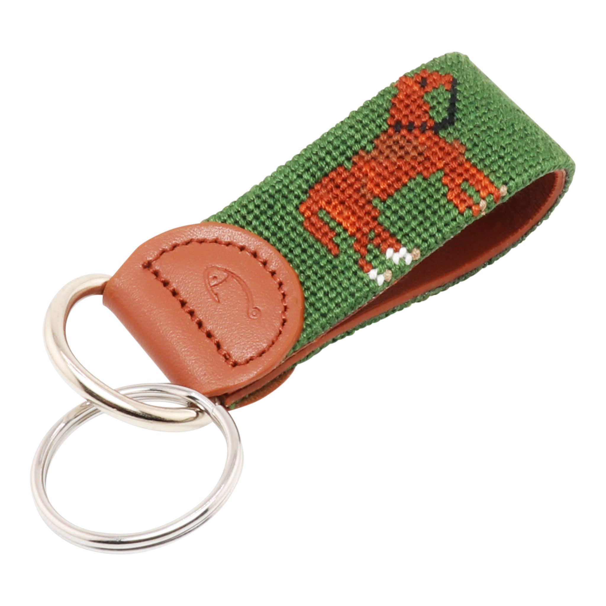A green and brown horse needlepoint key fob with a stainless ring and leather strap.