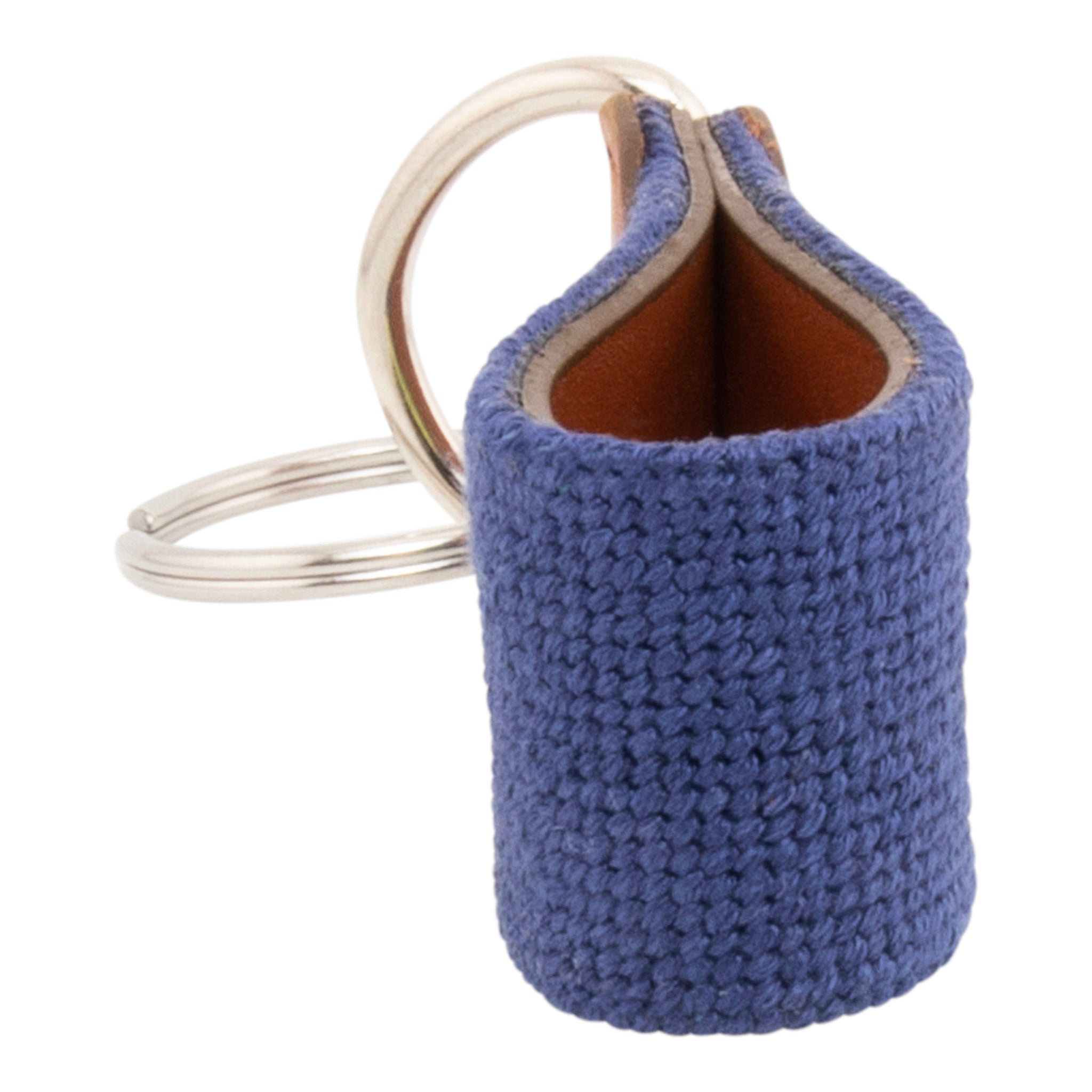 Hand-stitched lemon needlepoint keychain showing a Positano lemon on both sides against a navy blue background and leather backing.  Stainless steel D-ring and keyring.