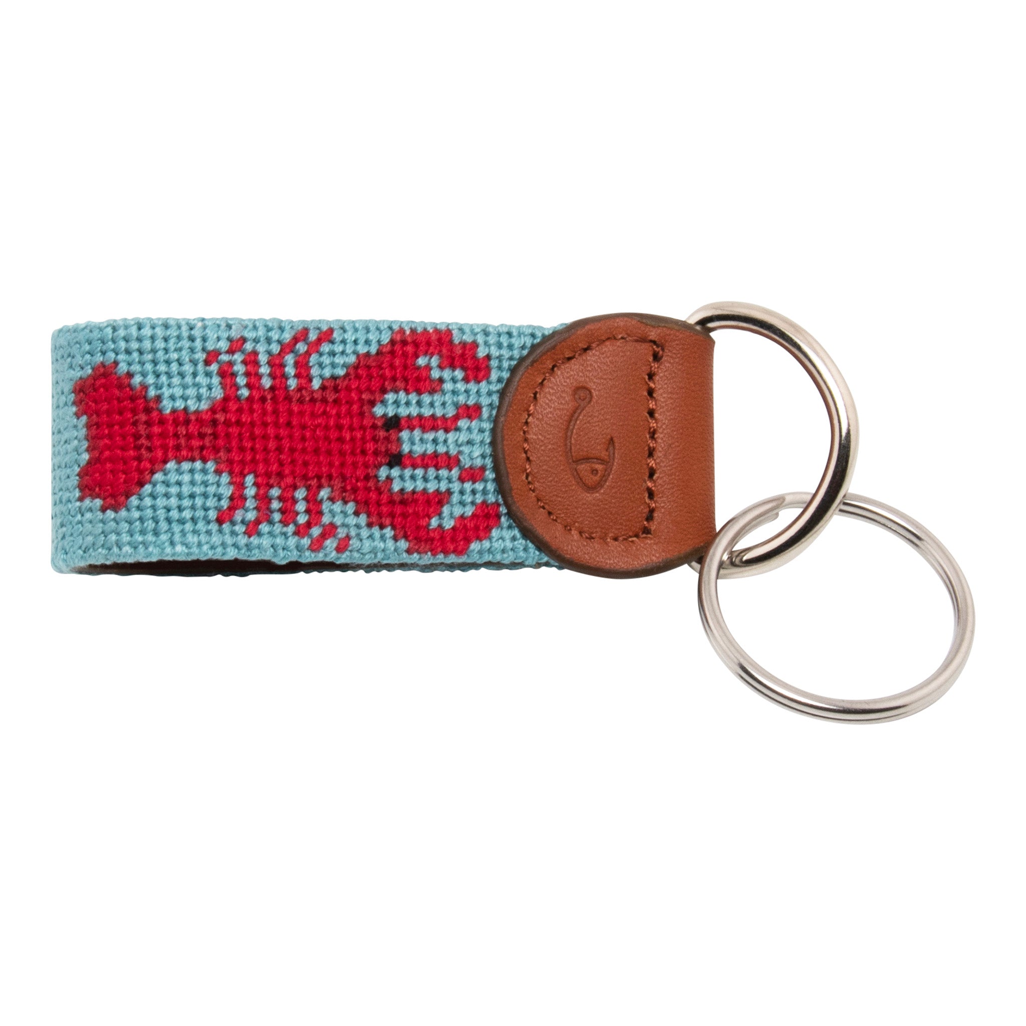 Hand-stitched lobster needlepoint keychain showing a red lobster on both sides against a light blue background and leather backing.  Stainless steel D-ring and keyring.