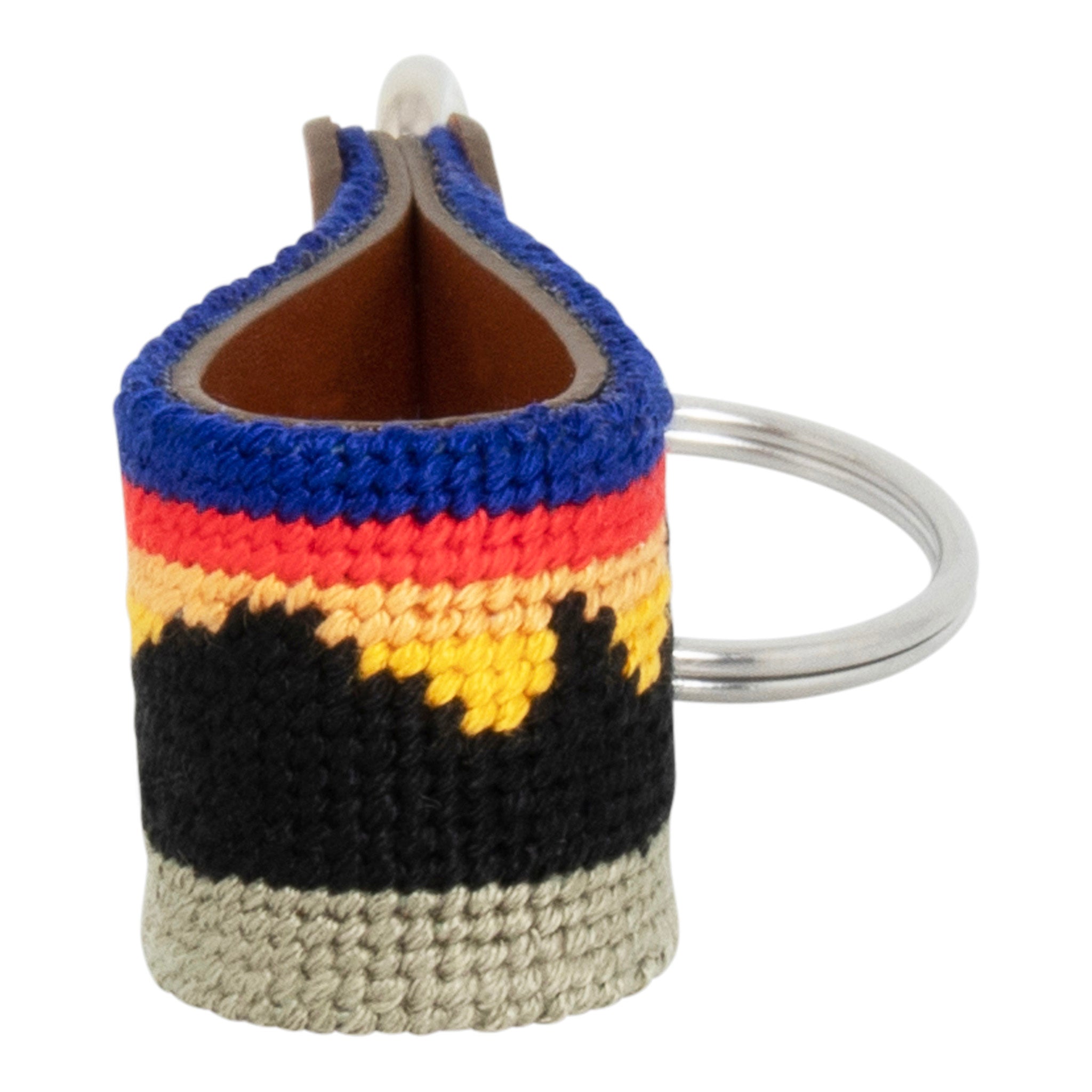 Hand-stitched Mountain Range needlepoint keychain showing a western mountain range pattern on both sides with leather backing.  Stainless steel D-ring and keyring.
