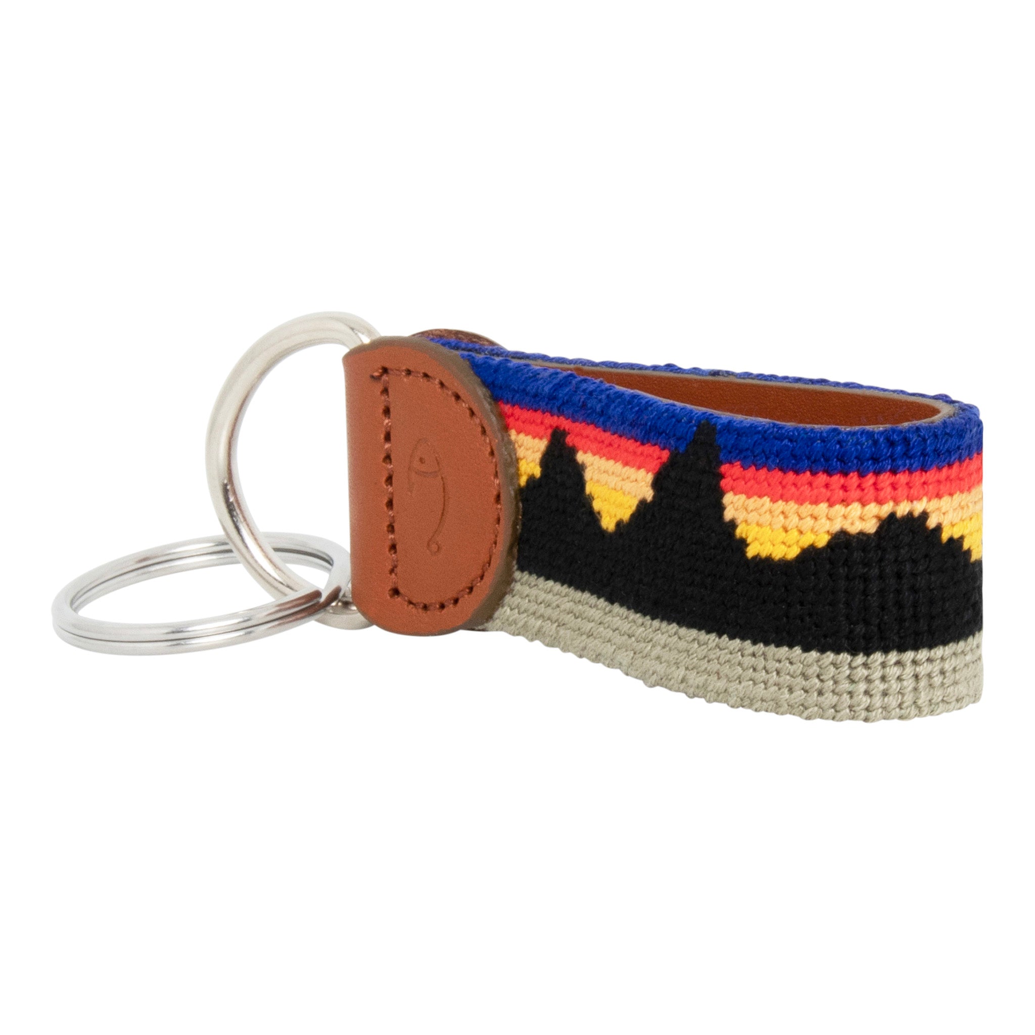Hand-stitched Mountain Range needlepoint keychain showing a western mountain range pattern on both sides with leather backing.  Stainless steel D-ring and keyring.