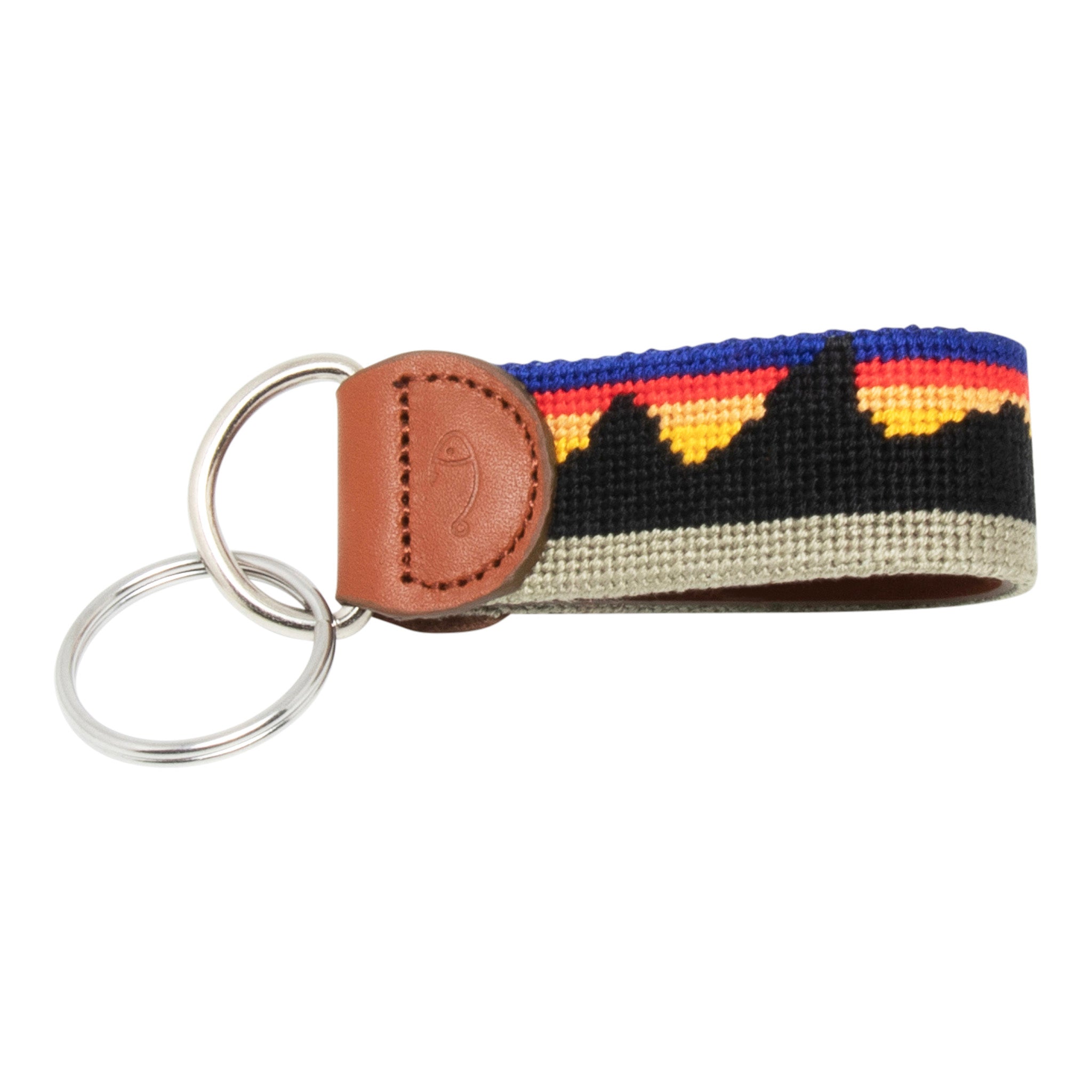 Hand-stitched Mountain Range needlepoint keychain showing a western mountain range pattern on both sides with leather backing.  Stainless steel D-ring and keyring.