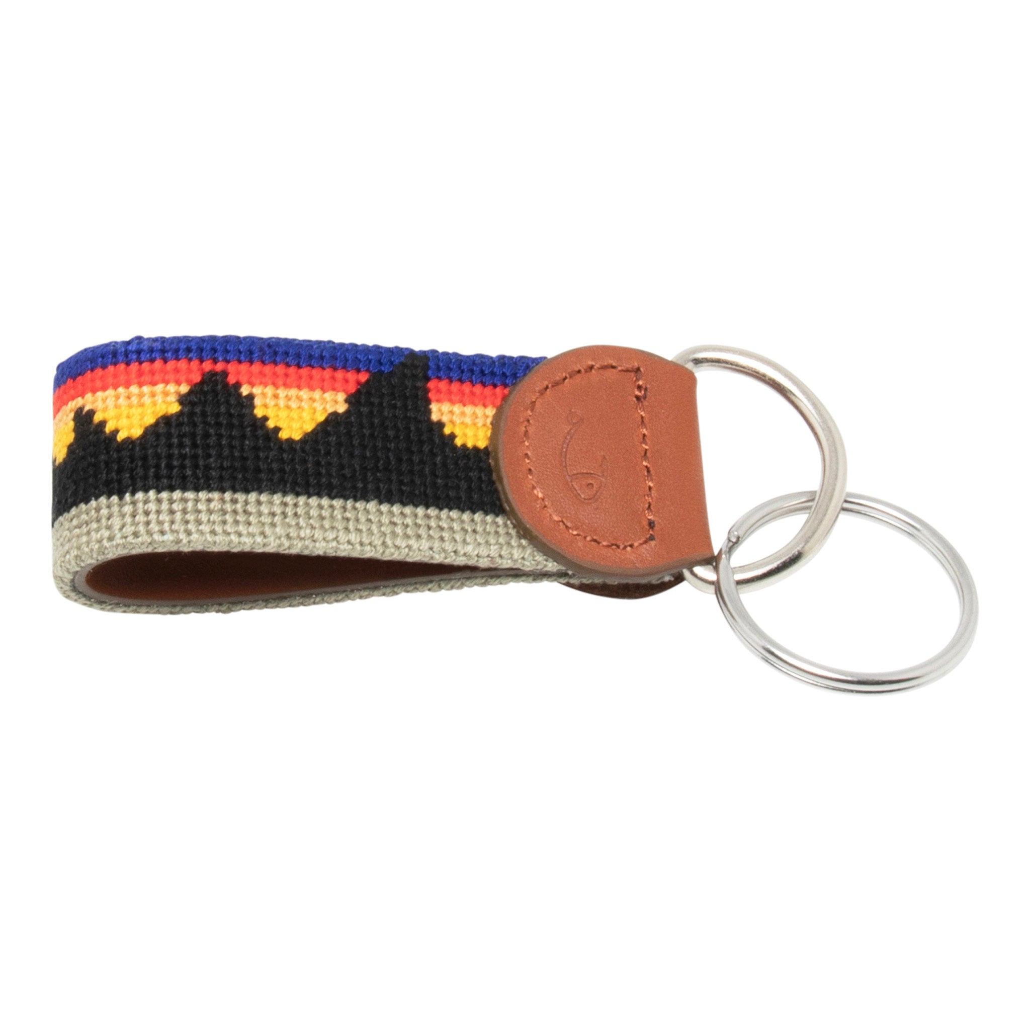 Hand-stitched Mountain Range needlepoint keychain showing a western mountain range pattern on both sides with leather backing.  Stainless steel D-ring and keyring.
