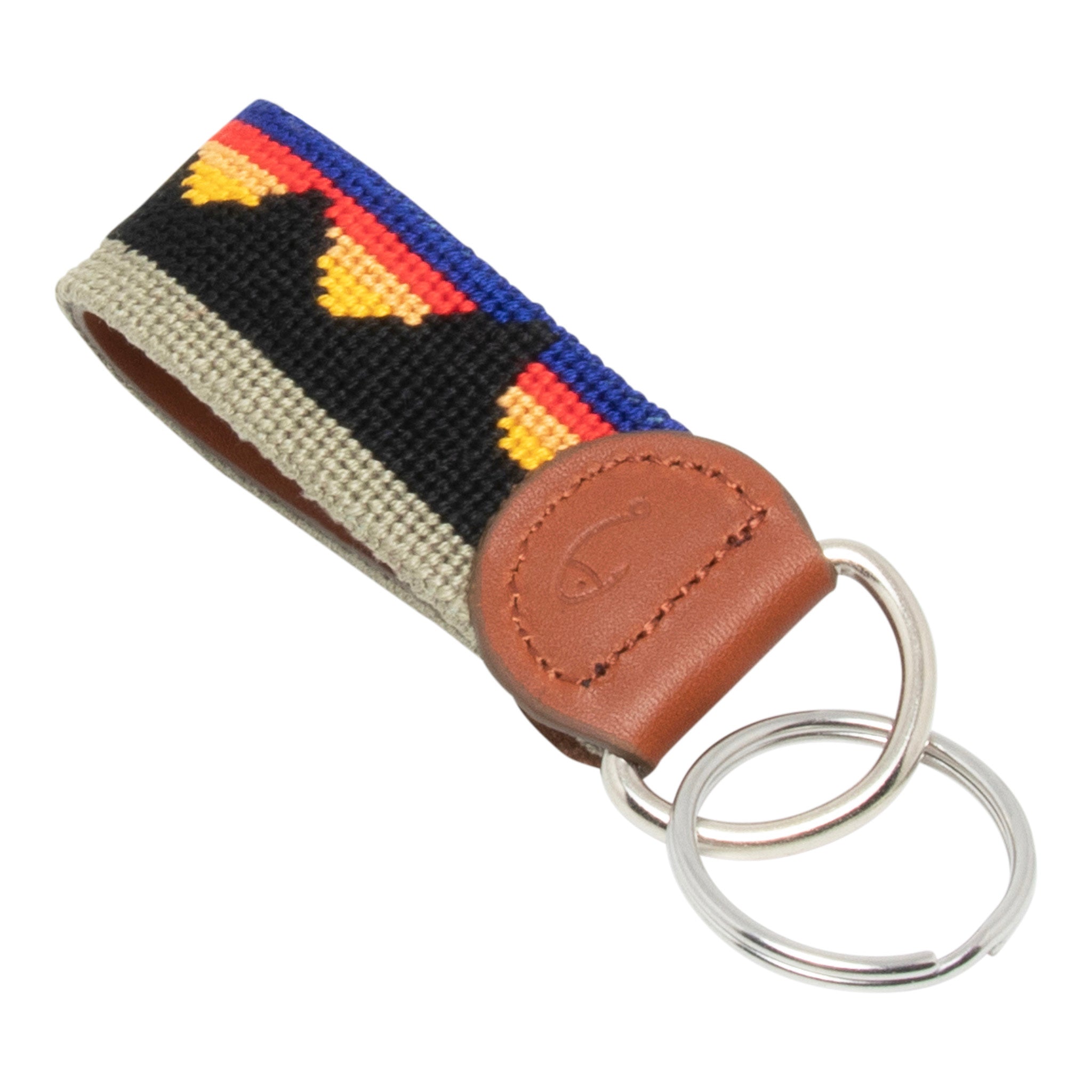 Hand-stitched Mountain Range needlepoint keychain showing a western mountain range pattern on both sides with leather backing.  Stainless steel D-ring and keyring.