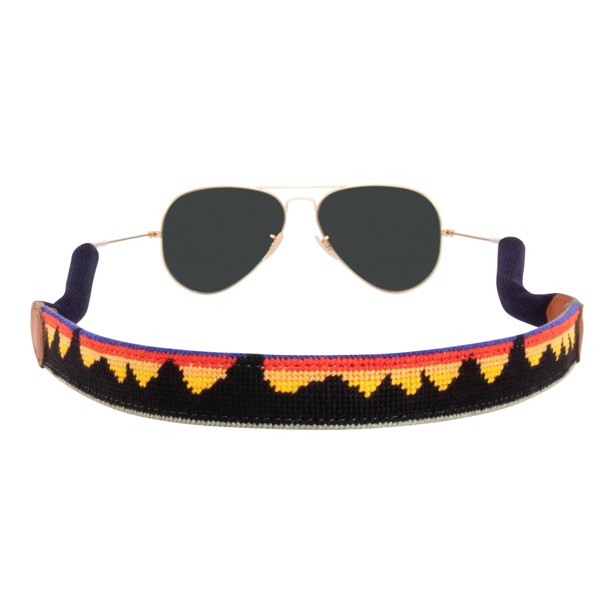 mountain range needlepoint sunglass strap showing a western mountain range inspired design with sturdy cotton covered silicone ear connectors and a soft leather backing