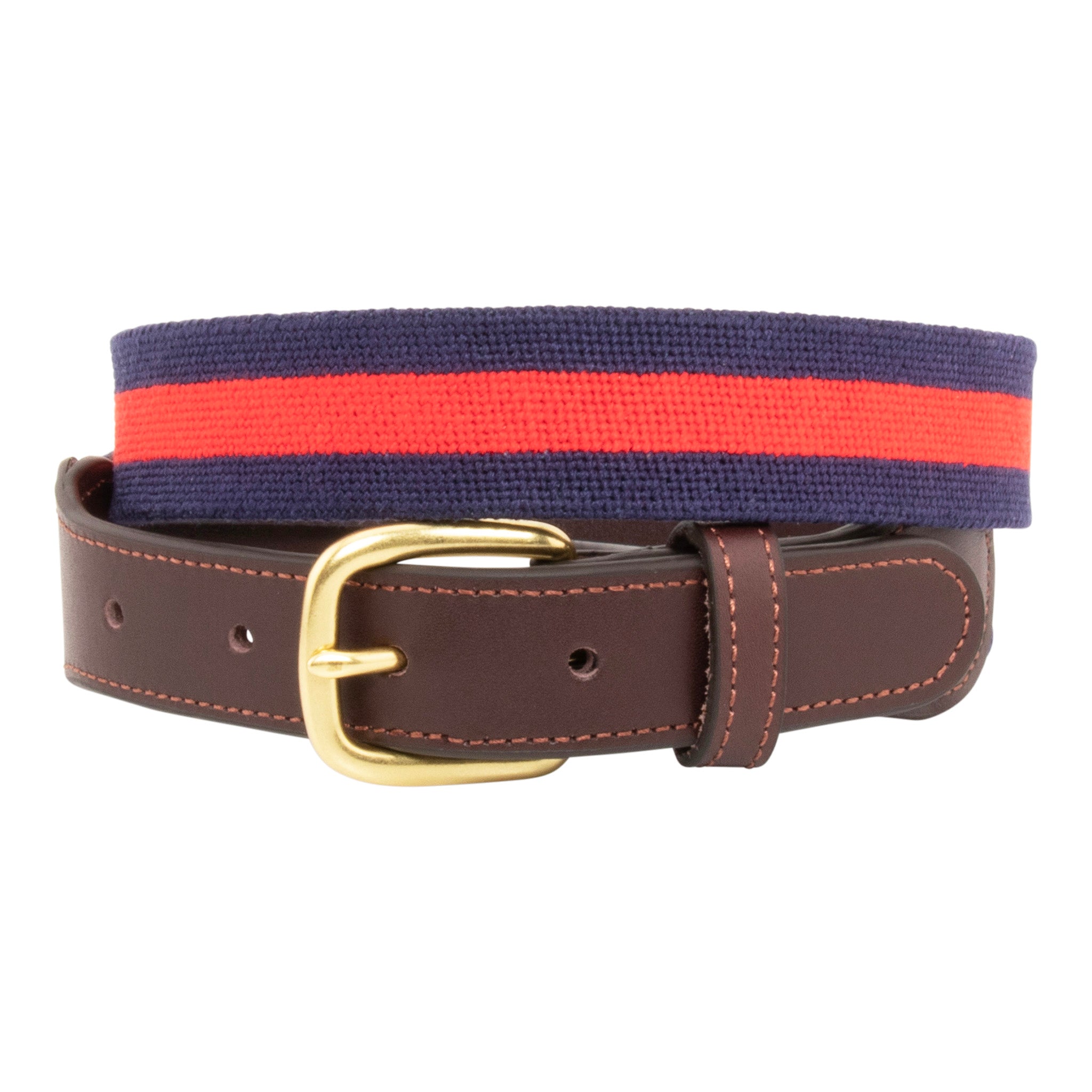 Navy Stripe Needlepoint Belt with a dark navy blue background showing a red stripe 1/3 the width of the belt going down the center of the belt. Belt has a brass buckle and full grain leather backing and strap.