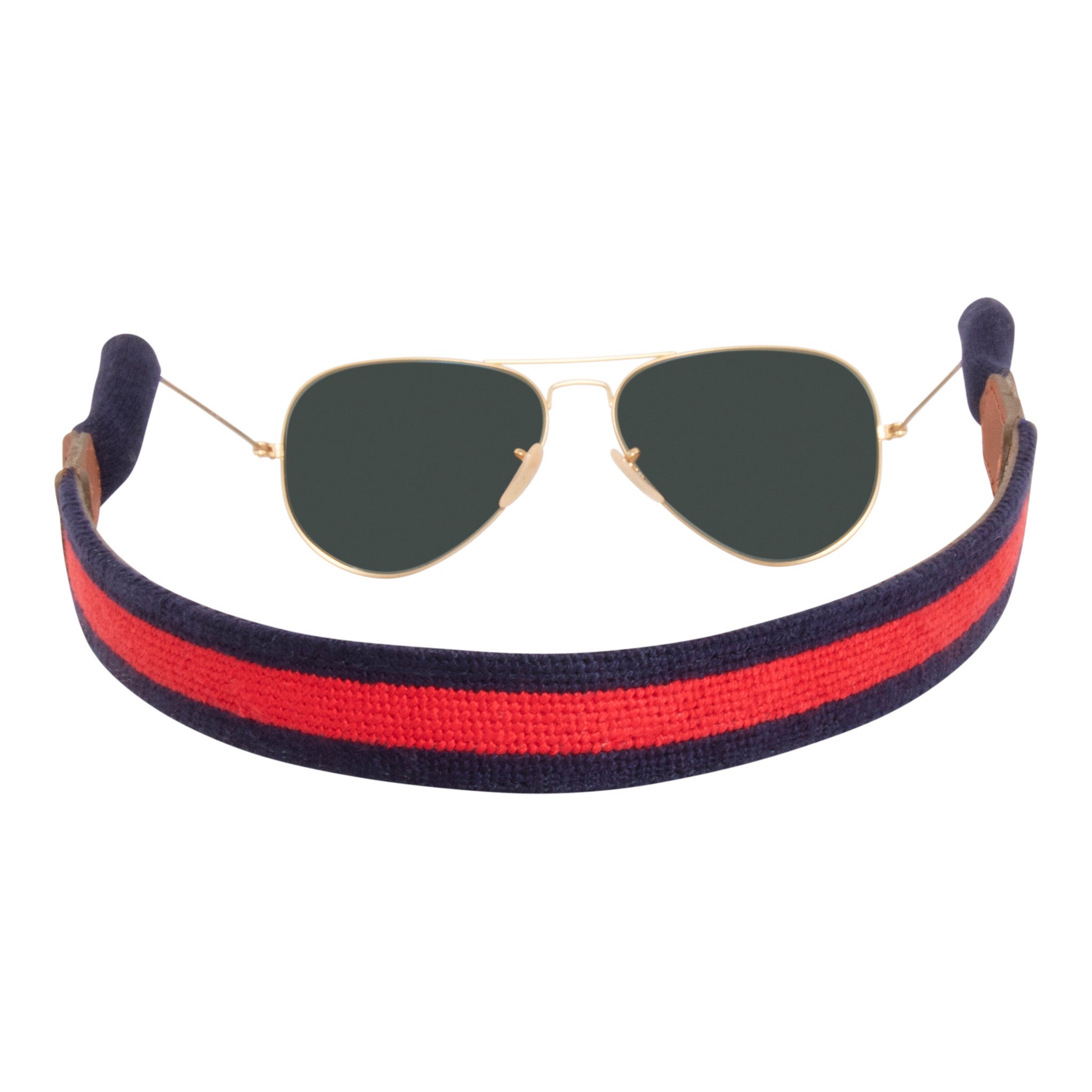 Red stripe with navy blue background needlepoint sunglass strap hand-stitched with sturdy cotton covered silicone ear connectors and a soft leather backing