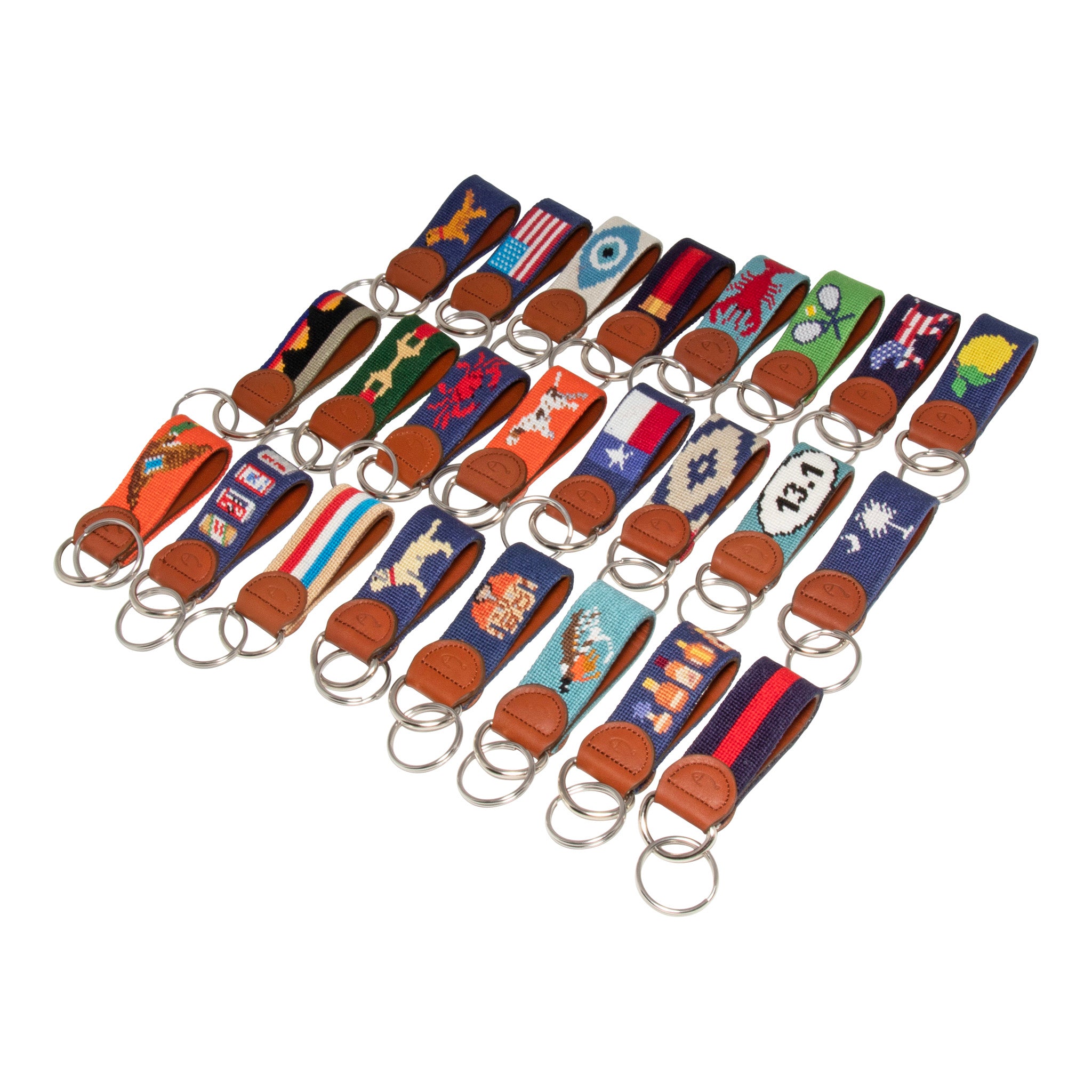 Huck Venture Needlepoint Keychain collection showing all handmade needlepoint key fobs in our catalog