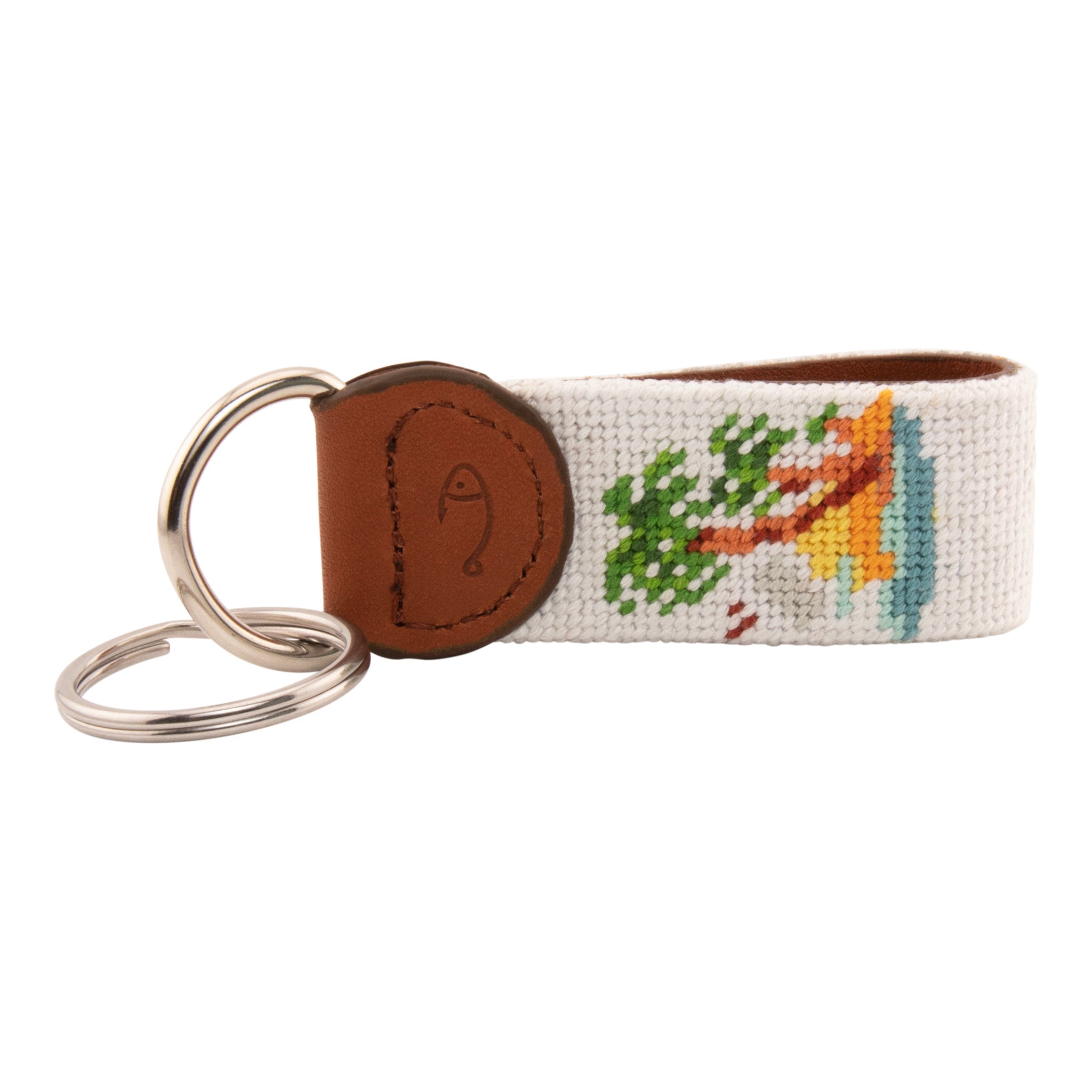 needlepoint keychain with palm tree design, same design on both sides, off white background, hand-stitched, leather background, stainless steel key ring, same design on both sides