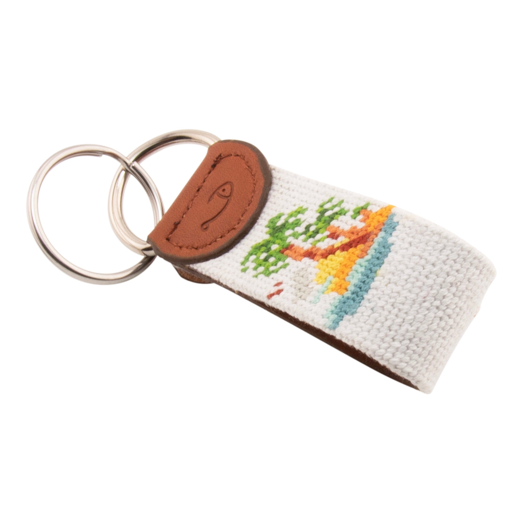 needlepoint keychain with palm tree design, same design on both sides, off white background, hand-stitched, leather background, stainless steel key ring, same design on both sides