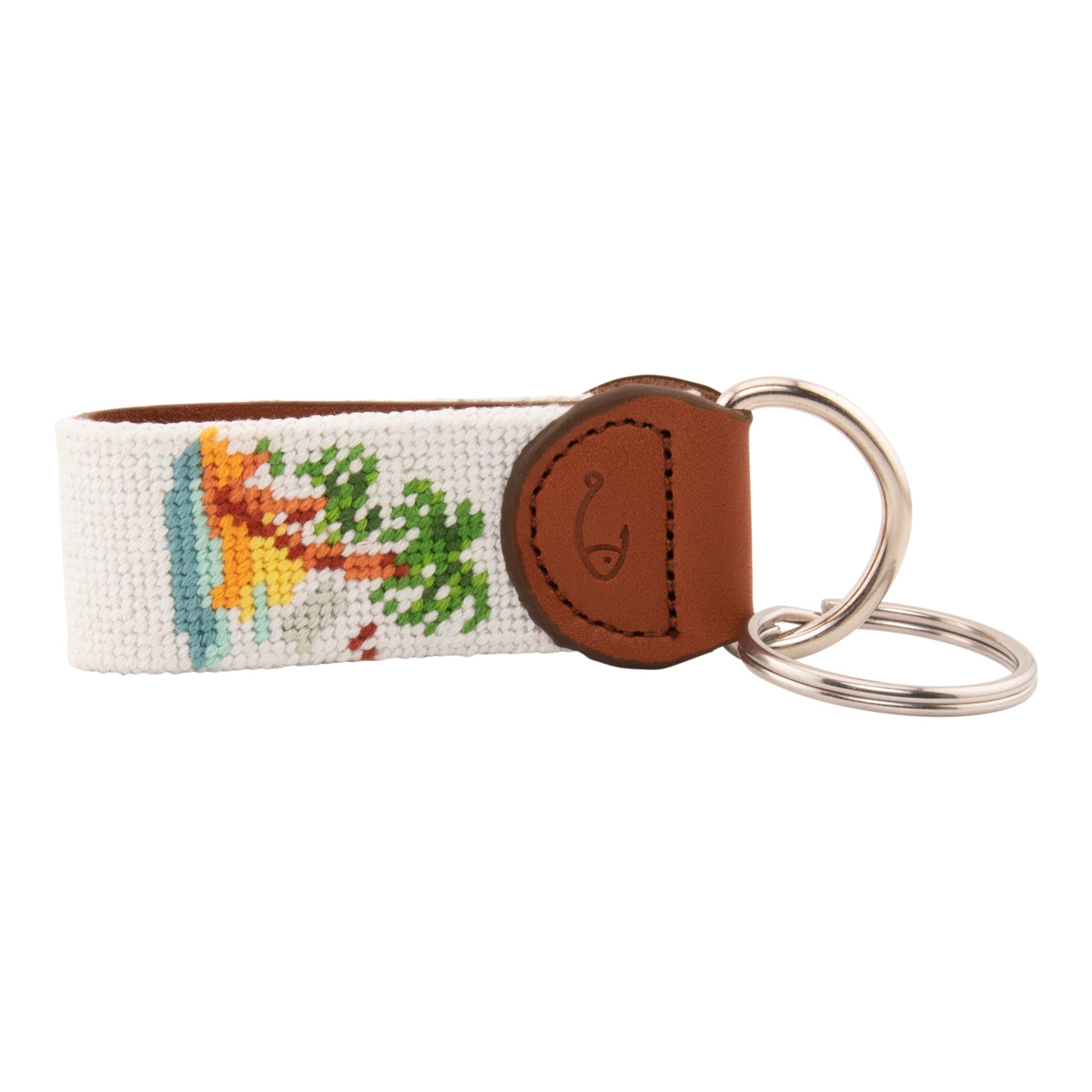 needlepoint keychain with palm tree design, same design on both sides, off white background, hand-stitched, leather background, stainless steel key ring, same design on both sides