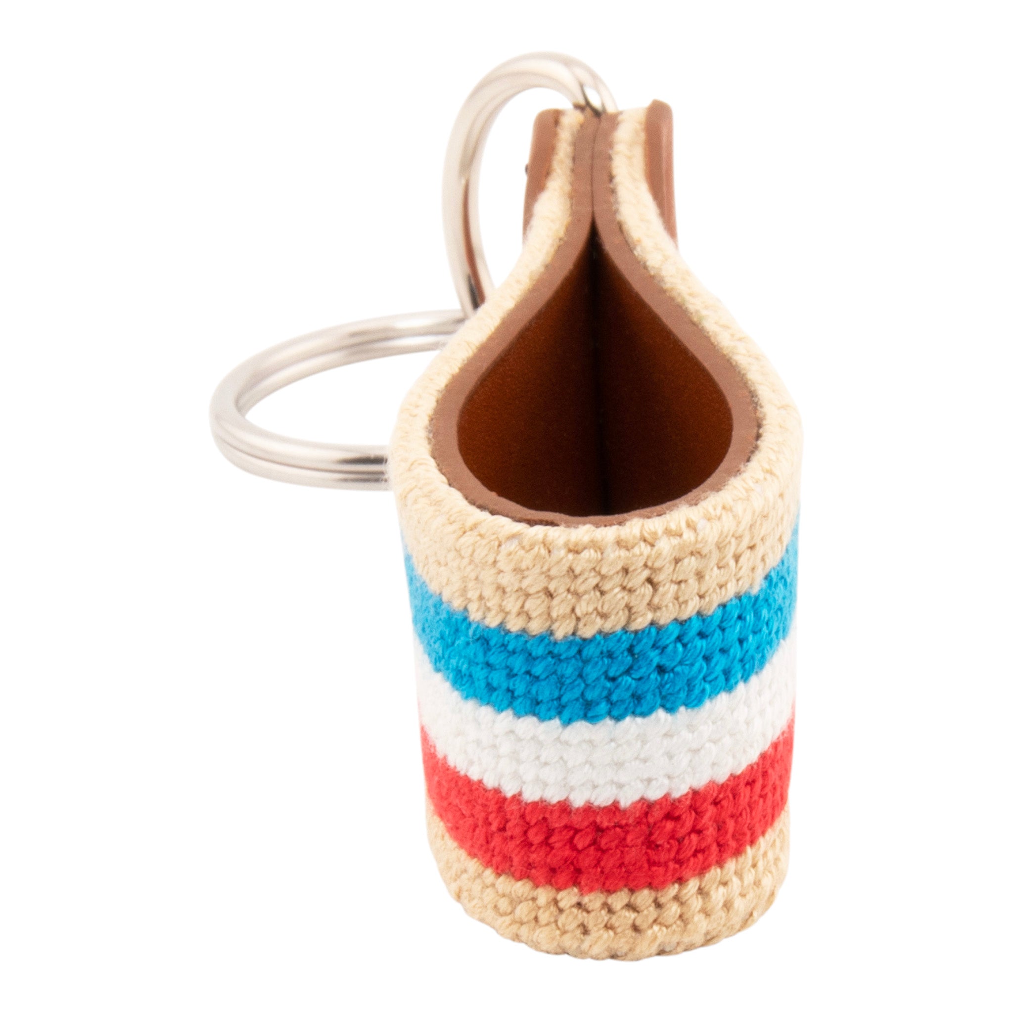needlepoint keychain with blue white and red stripes on light tan background, design wraps around to both sides, hand-stitched, leather background, stainless steel key ring, same design on both sides