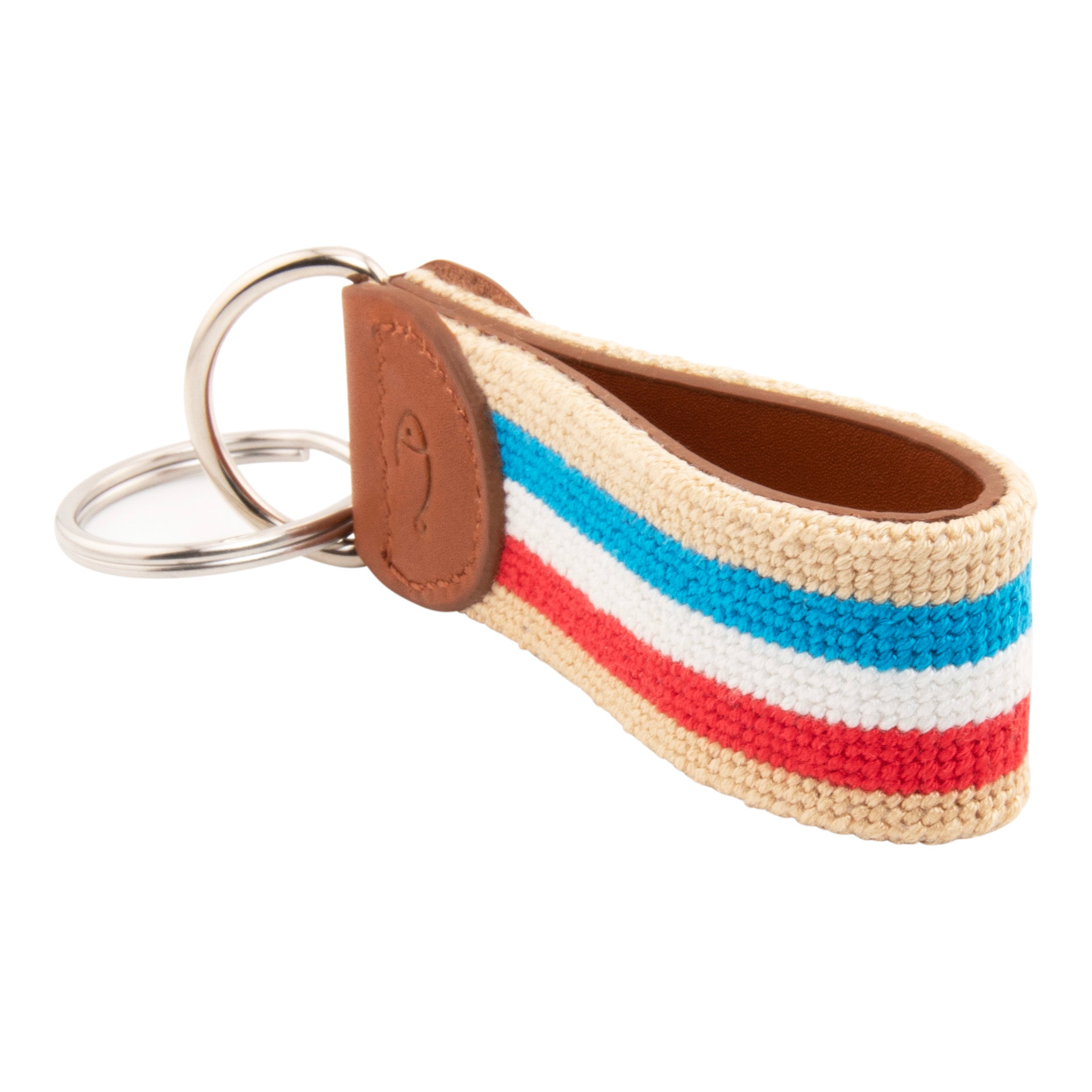 needlepoint keychain with blue white and red stripes on light tan background, design wraps around to both sides, hand-stitched, leather background, stainless steel key ring, same design on both sides