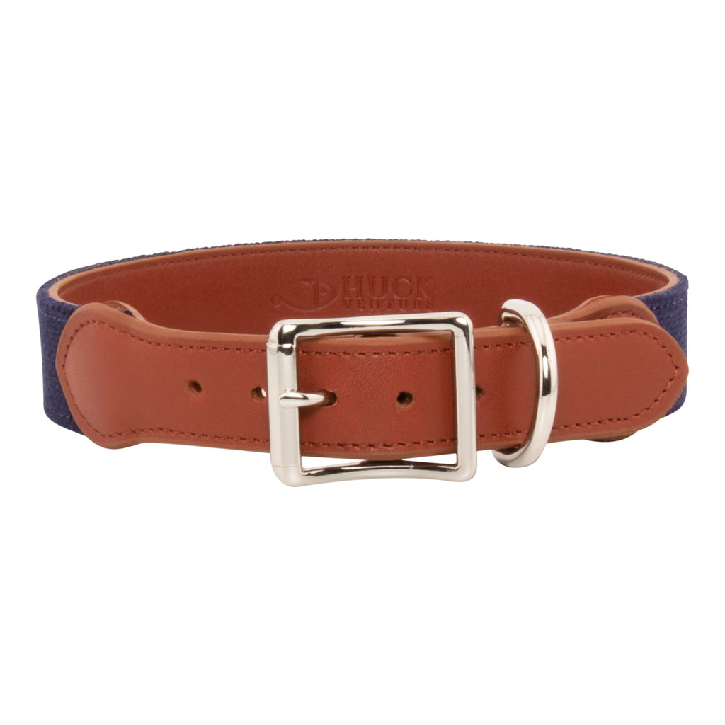 Patriotic Dog Needlepoint Dog Collar with navy blue background showing a repeating pattern of evenly spaced dog silhouette filled with the pattern of the American Flag. The dog collar has durable stainless steel and full grain leather backing and strap.