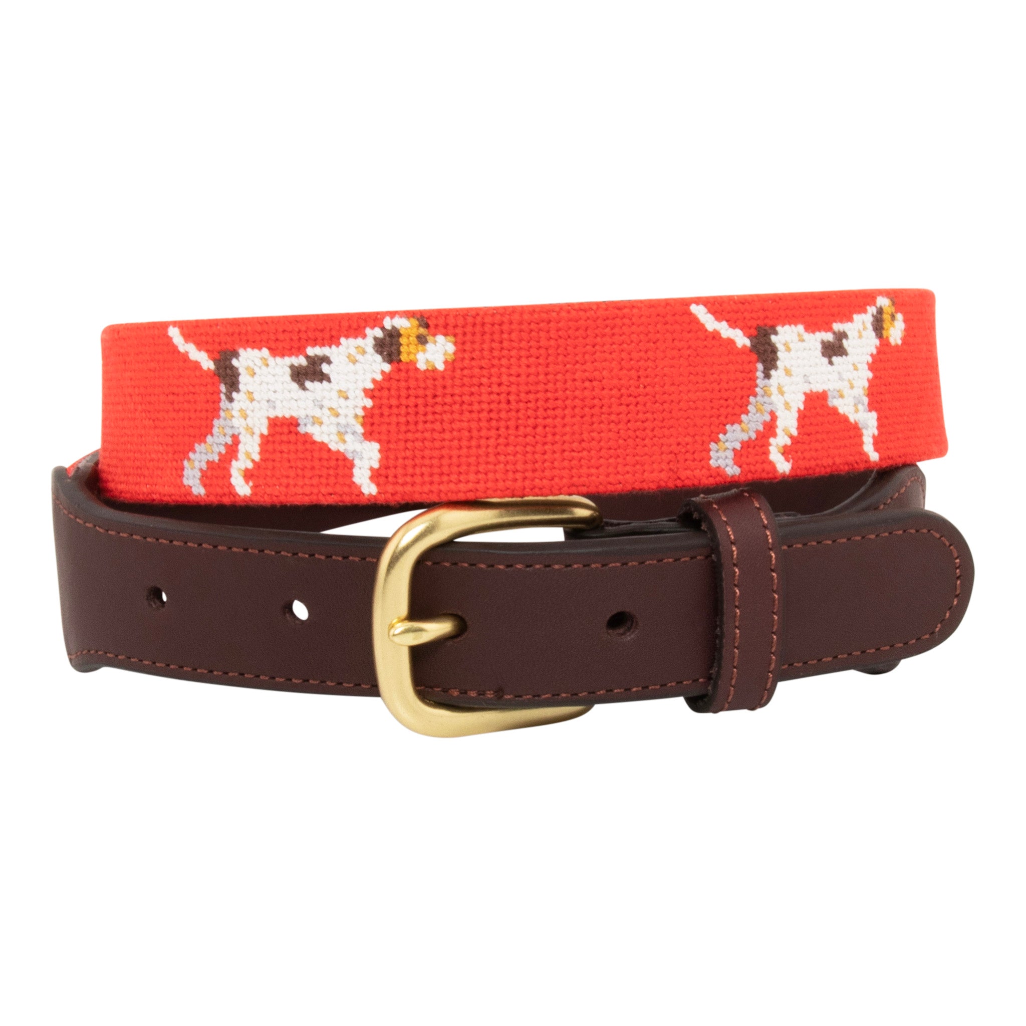 Pointer Dog Needlepoint Belt with a blaze orange background showing a repeating pattern of evenly spaced upland hunting dogs in a pointing stance. The belt has a brass buckle and full grain leather backing and strap.