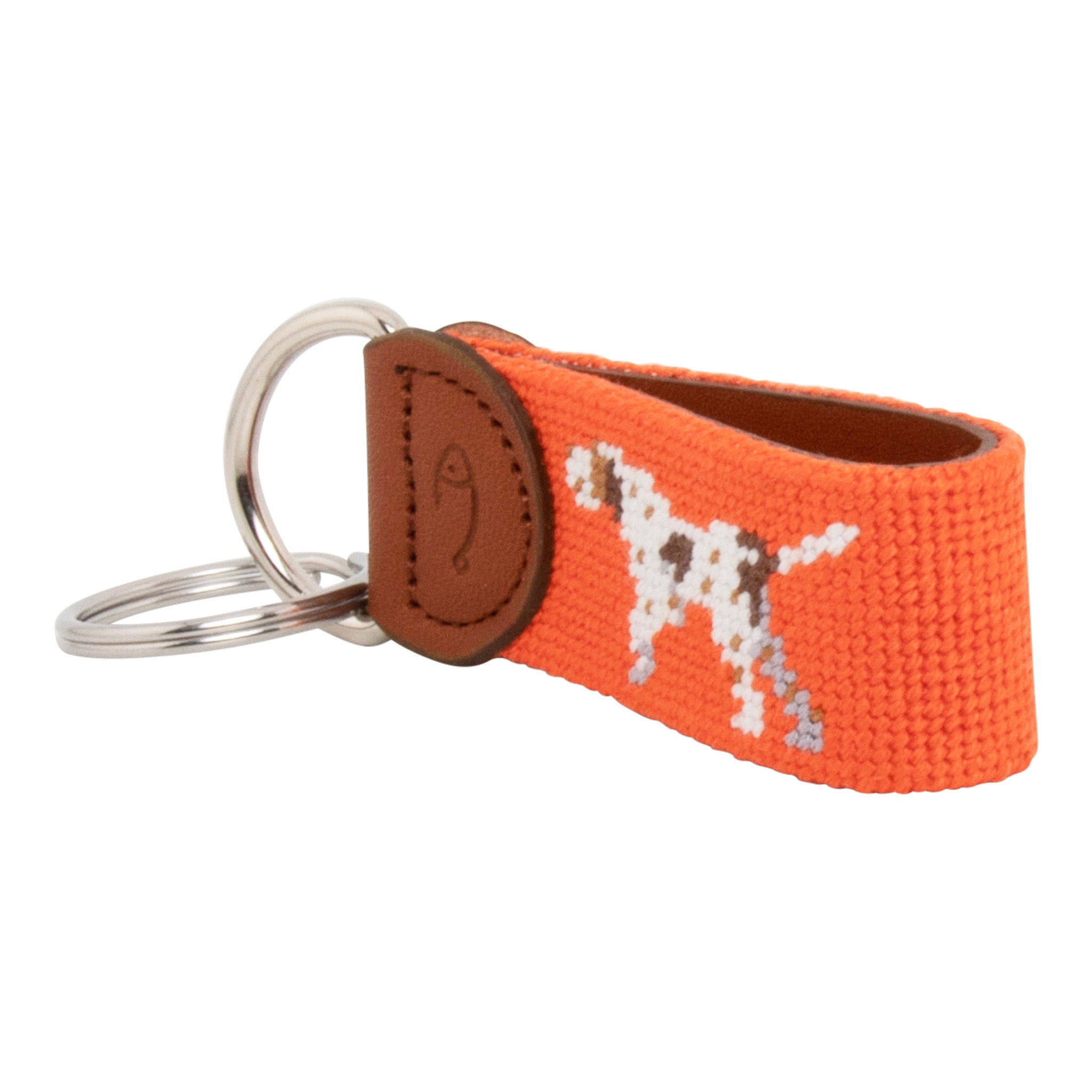 Hand-stitched Pointer Dog needlepoint keychain showing a dog in pointing stance on both sides against a blaze orange background and leather backing.  Stainless steel D-ring and keyring.